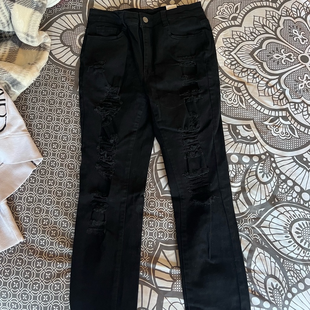 Never worn black ripped jeans